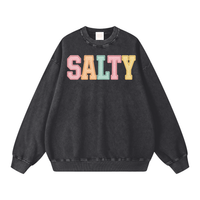 Load image into Gallery viewer, Black oversized washed sweatshirt with colorful embroidered SALTY varsity lettering