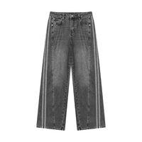 Load image into Gallery viewer, Light blue wide-leg denim jeans with double vertical white stripes running down the outer sides of the legs, shown against a plain white background.
