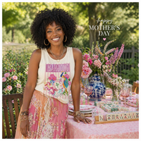 Load image into Gallery viewer, Woman in a garden setting with flowers and a table, celebrating Mother's Day.