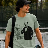 Load image into Gallery viewer, Man wearing Bay green Lob Father pickleball shirt while walking toward outdoor pickleball courts carrying a paddle.