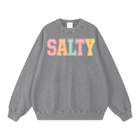 Load image into Gallery viewer, Sand-colored oversized heavyweight sweatshirt featuring colorful embroidered SALTY text