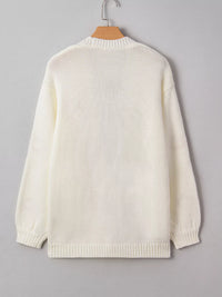 Load image into Gallery viewer, The back of the Ivory cardigan with orange embroidered pumpkins all over the front.