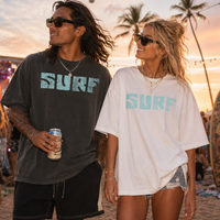 Load image into Gallery viewer, Two people wearing 'SURF' t-shirts at a beach sunset event.
