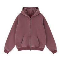 Load image into Gallery viewer, A dusty rose zip-up hoodie with a front zipper, kangaroo pockets, and ribbed cuffs and hem, shown against a plain white background.