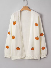Load image into Gallery viewer, Ivory cardigan with orange embroidered pumpkins all over the front is hanging from a hanger.