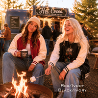 Load image into Gallery viewer, Red ivory and black ivory varsity jackets styled at a fall campfire and hot cocoa stand