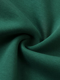 Load image into Gallery viewer, Close up of the fabric of the green sweatshirt 
