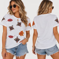 Load and play video in Gallery viewer, Women’s Sequin Thanksgiving Turkey &amp; Autumn Leaf T-Shirt – Short Sleeve Fall Graphic Tee